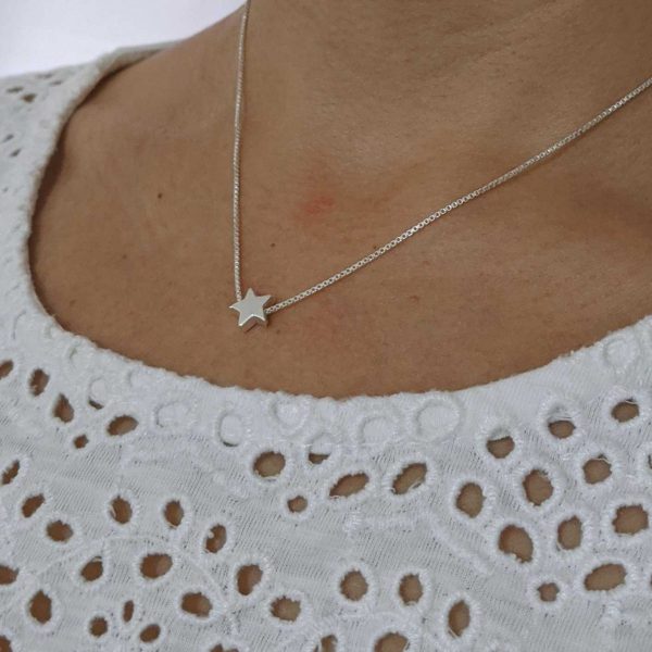 dije con cadena estrella
