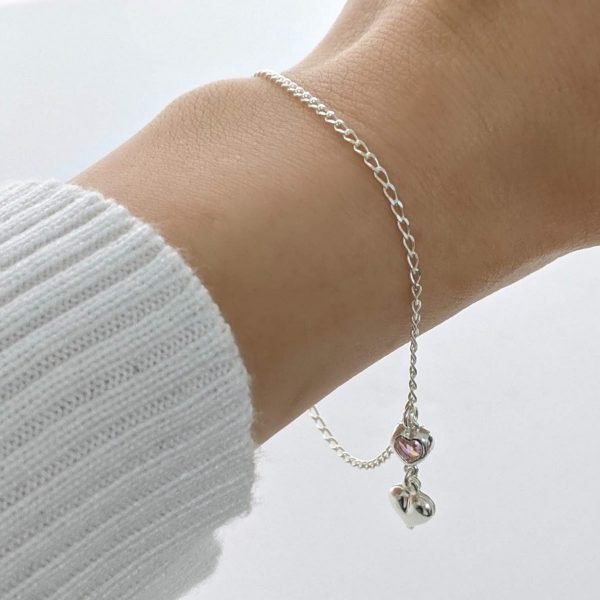Pulsera con dije de corazón y cubic rosa mano