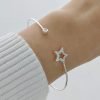 Esclava estrella con cubic micropave mano