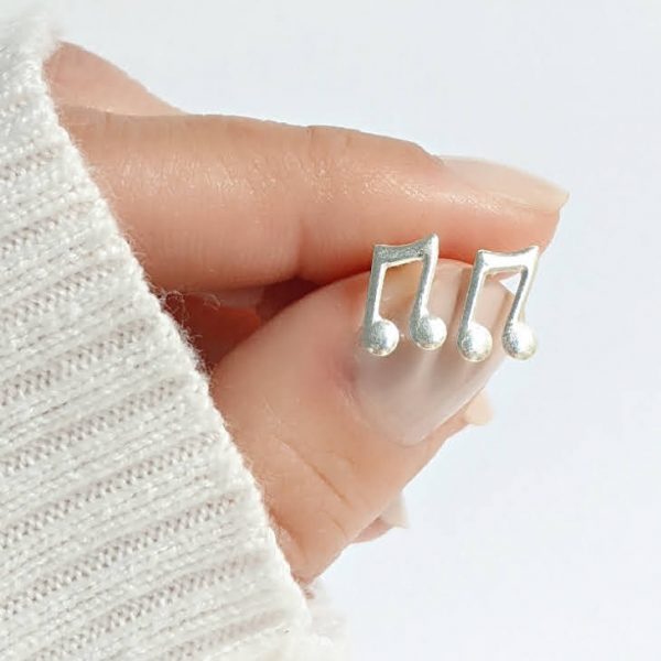 aros abridores nota musical mano