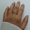 anillo bolitas en mano