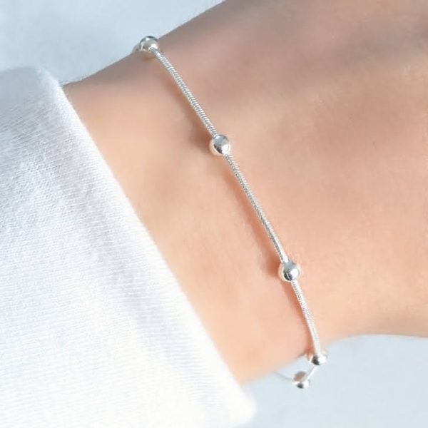 Pulsera clapton con bolitas